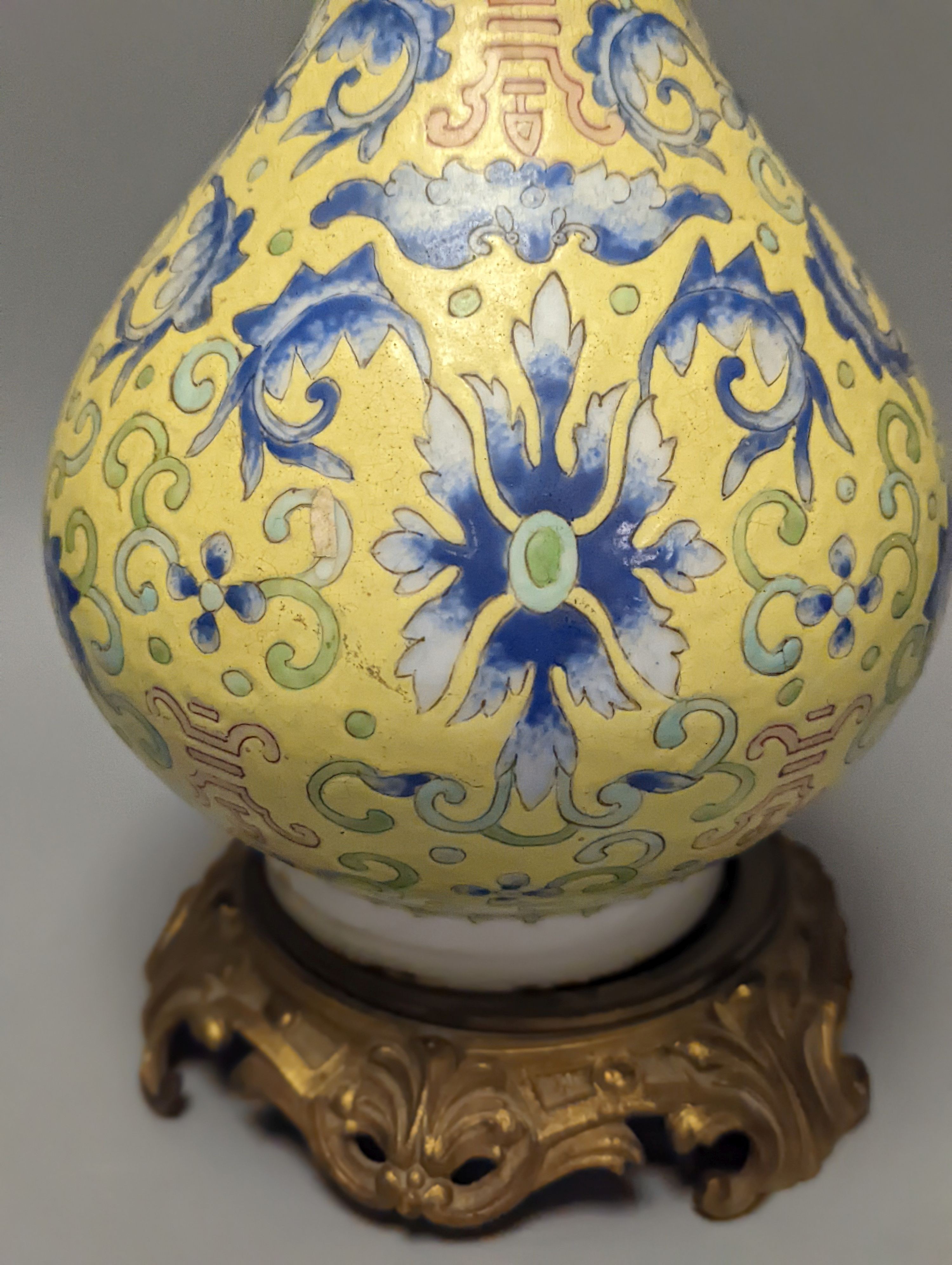 A Chinese yellow ground vase, raised on a gilt bronze base 38cm